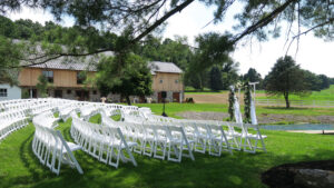 Philadelphia wedding venue outdoor ceremony with luxury chairs, natural beauty and views of the Lancaster Pennsylvania countryside