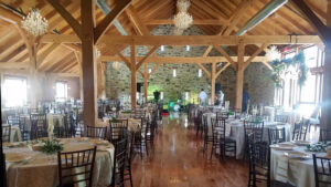 Lancaster wedding venue reception in a luxury rustic wedding barn with beautiful tables, chairs and decor