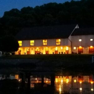 Lancaster Pennsylvania historic wedding venue outdoor ceremony at night with romantic lighting and waterfront views