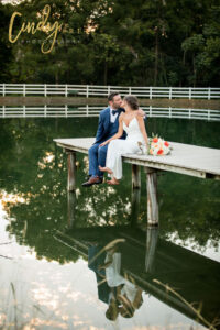 Lancaster Pennsylvania wedding venue bride & groom pose by the water for their wedding day photography