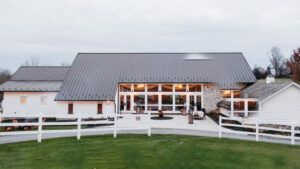 Lancaster Pennsylvania wedding venue outdoor ceremony with luxury chairs, arch and landscaping