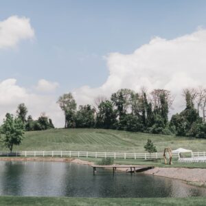 Philadelphia wedding venue outdoor ceremony site with waterfront views and acres of green landscaping. 