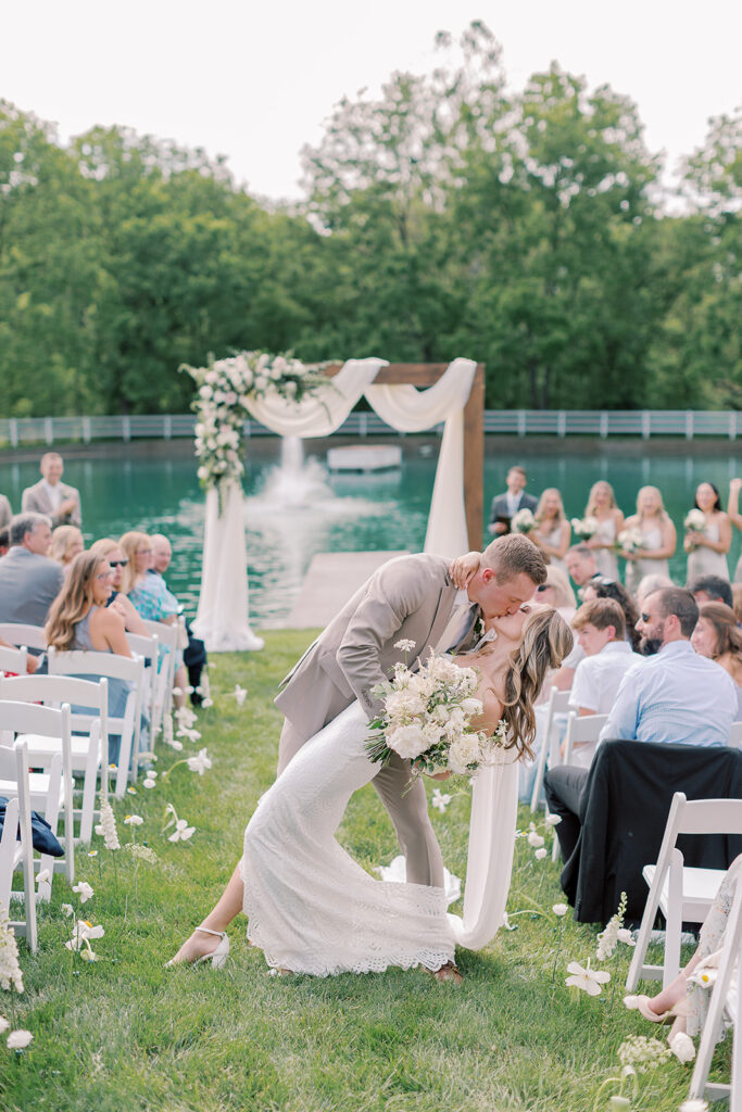 first kiss in aisle outside at bluestone estate
