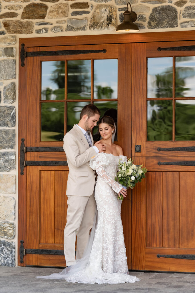 recently married couple outside doors of bluestone estate