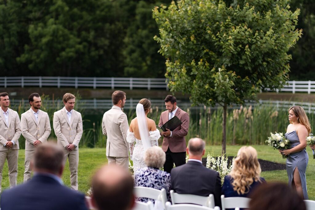 engaged couple exchanging vows at an outdoor wedding ceremony near Philadelphia 