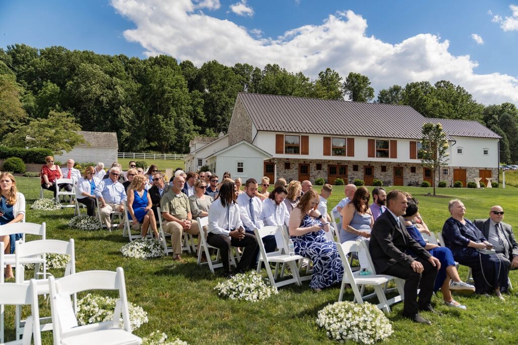 Wedding guests wearing elegant garden wedding attire. 
