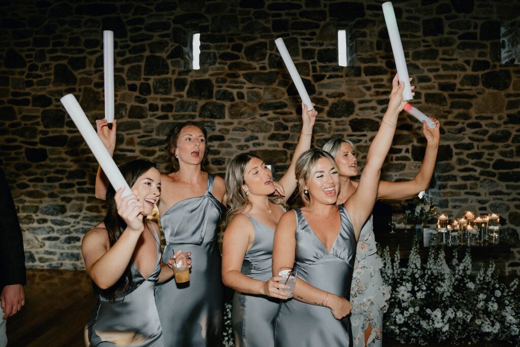 Bridesmaids wearing blue bridesmaid dresses at a wedding reception at a historic estate wedding venue near Philadelphia